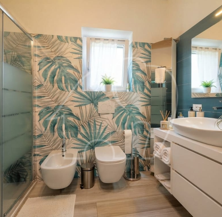Appartamento su due livelli con vista lago e dependance